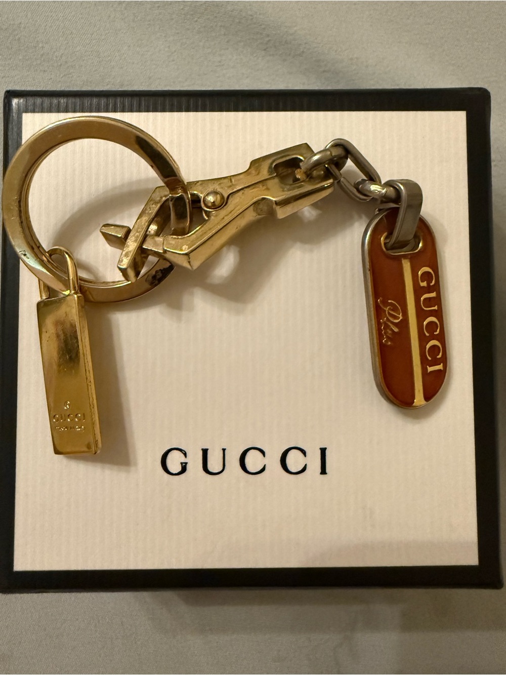 Gucci Plus mixed metal and red enamel keychain